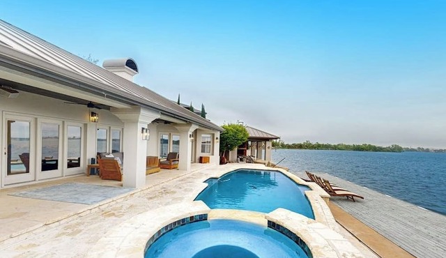 Luxe lakefront retreat with private pool, spa, lakeside terrace, gourmet kitchen